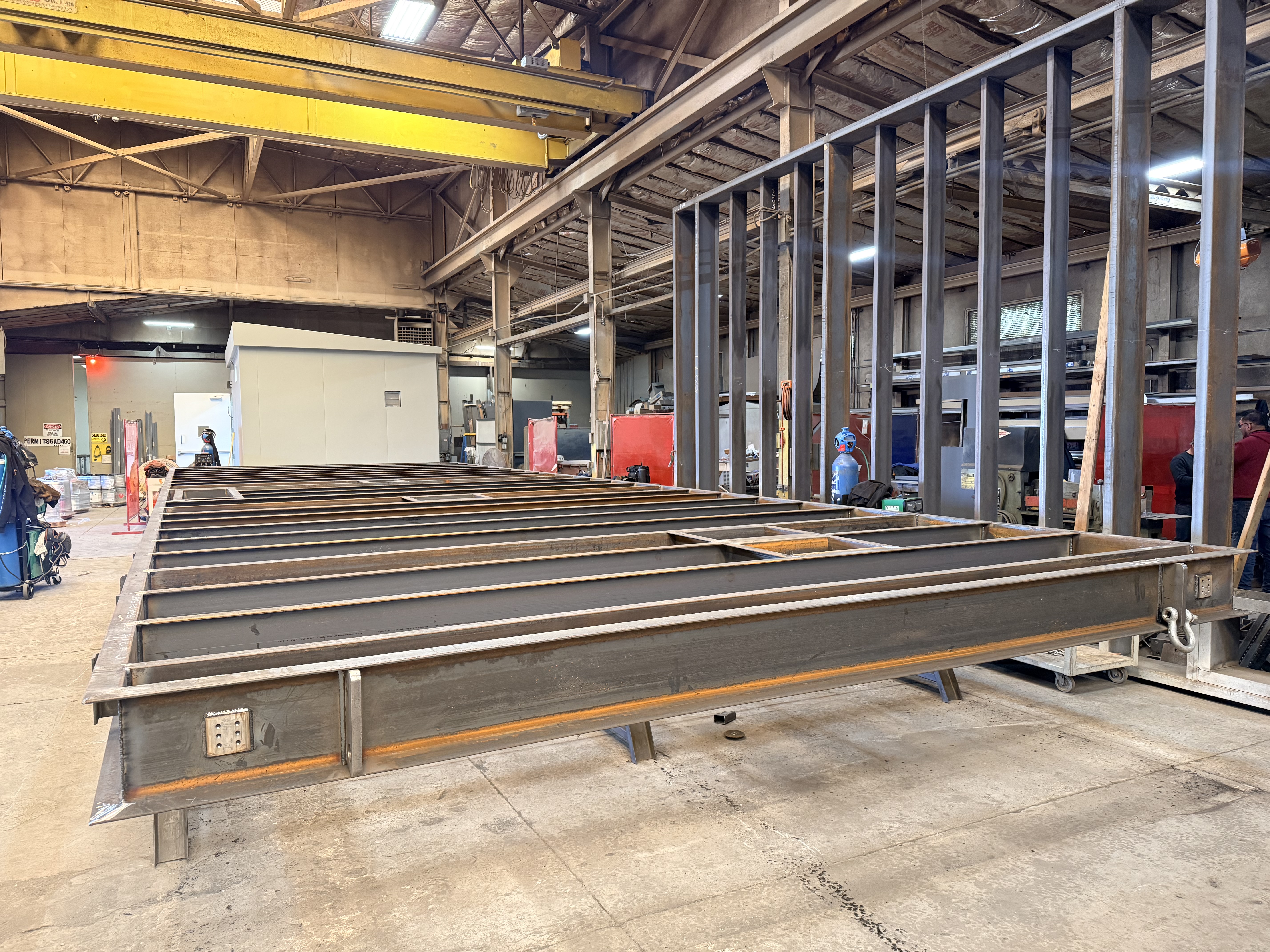 Structural steel skid and wall framing — JQMC enclosure